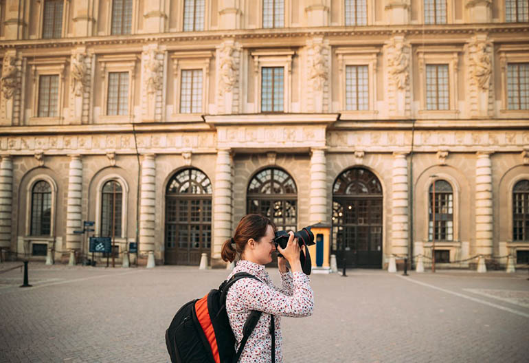 Tourist taking picture at Royal Palace