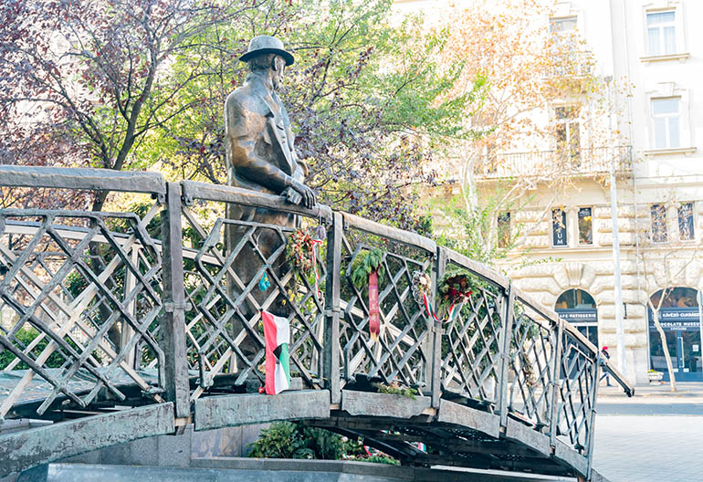 Sculpture of a man on a bridge