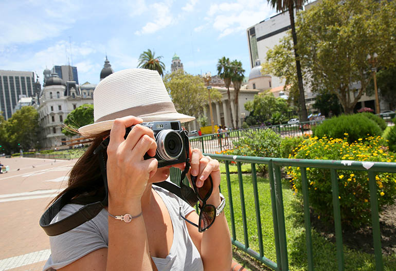 Tourist taking picture at Plaza de Mayo